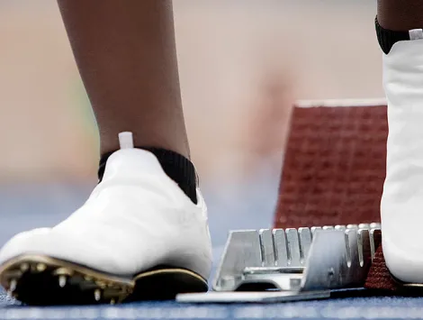 Runner's feet at a starting line. Photo Credit:gettyimages/Robin Skjoldborg