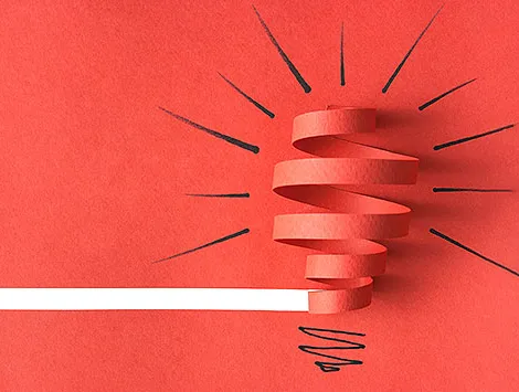 A light bulb made of construction paper